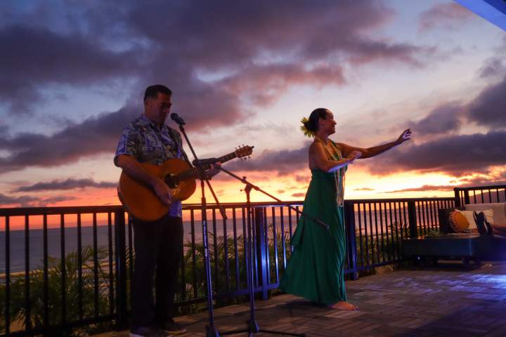 a man standing in front of a pier